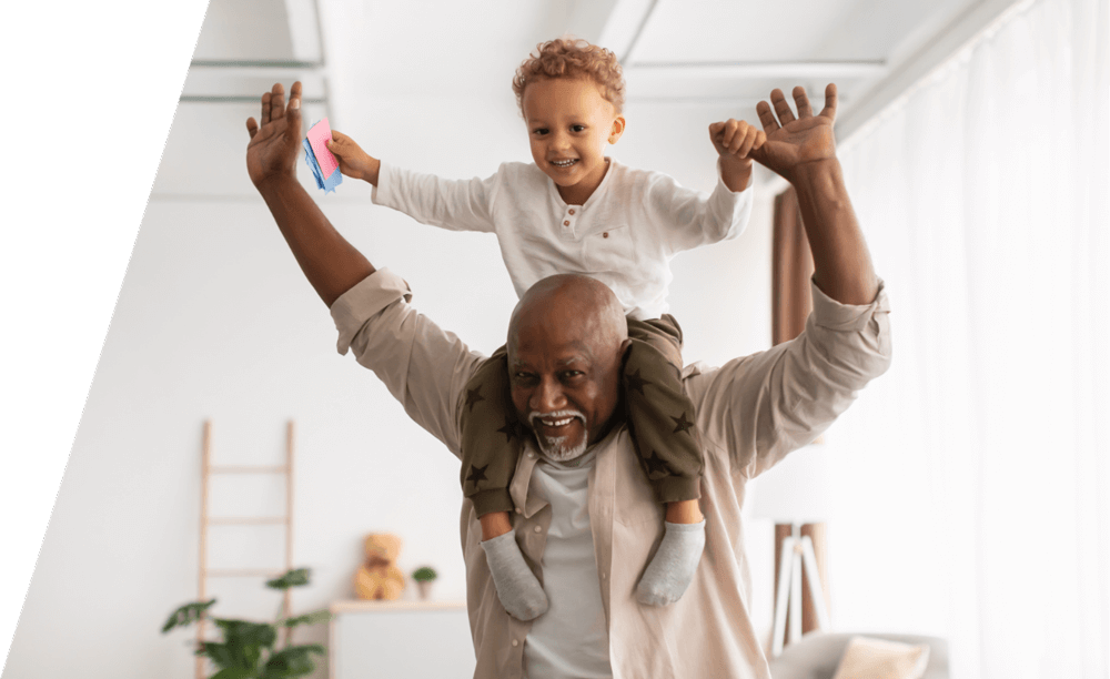 man and child on shoulders